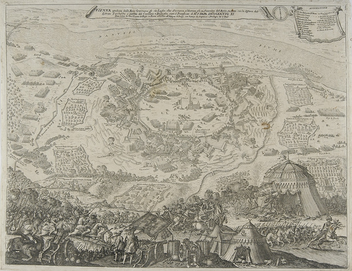 Stara rycina przedstawiająca widok z góry na miasto. Powyżej płynie rzeka. Na obrzeżach miasta, na polach widać rozłożone namioty. W dolnej części kompozycji wojska i namioty tureckie. Jest to grafika przedstawiająca bitwę pod Wiedniem. 