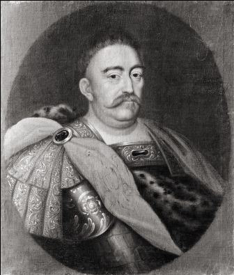 Portret Jana III Sobieskiego. Wizerunek króla ujęty jest w eliptyczny kadr. Król patrzy na wprost. Ubrany jest w zbroję i dalię spiętą na ramieniu broszą z kamieniem. 