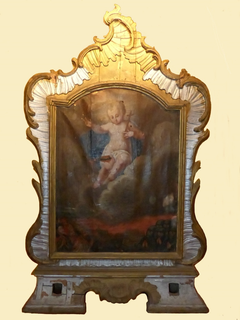 Olej na płótnie. Większą część kompozycji rewersu zajmuje Dzieciątko Jezus w otoku z obłoków. Jezus trzyma w lewej ręce krzyż, prawą zaś błogosławi adorujących go wiernych ukazanych w dolnej partii obrazu. 